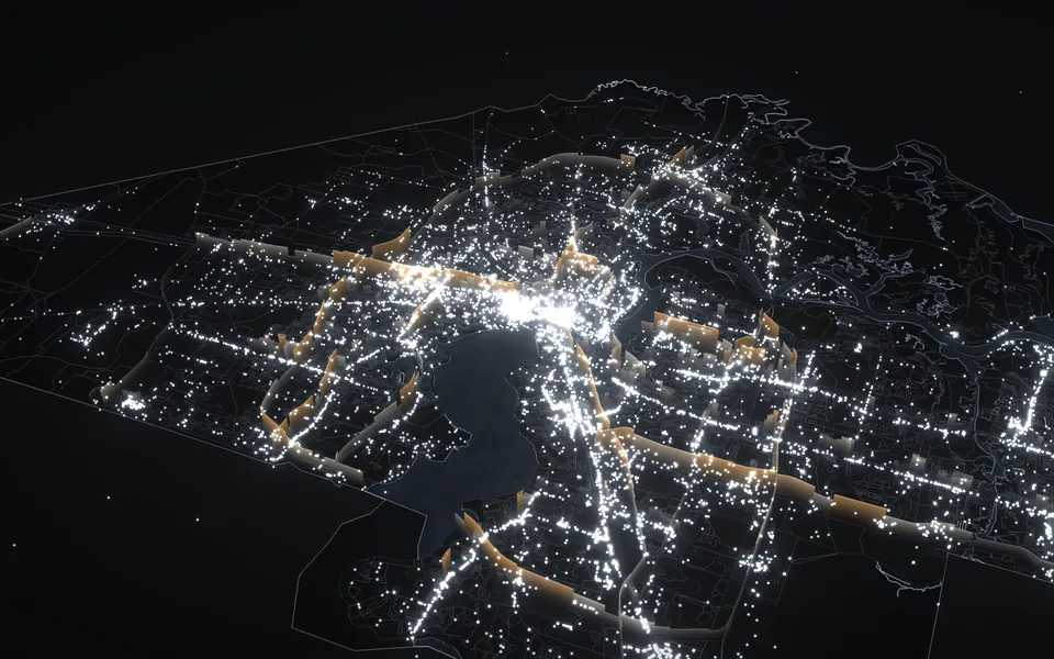 The 3D city model at night, with the city's facilities lit like stars